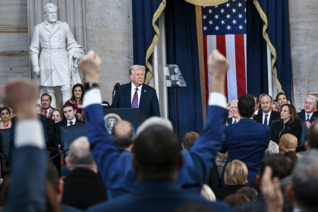 Attendees cheer as President Donald Trump speaks after taking the oath of office during the 60th Presidential Inauguration in the Rotunda of the US Capitol in Washington, Monday, January 20, 2025. (Kenny Holston/The New York Times via AP, Pool)
