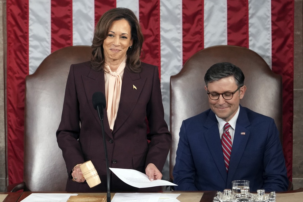 Vice President Kamala Harris reads the results as House Speaker Mike Johnson of La., listens during a joint session of Congress to confirm the Electoral College votes, affirming President-elect Donald Trump's victory in the presidential election, Monday, Jan. 6, 2025, at the U.S. Capitol in Washington. (AP Photo/Matt Rourke)
