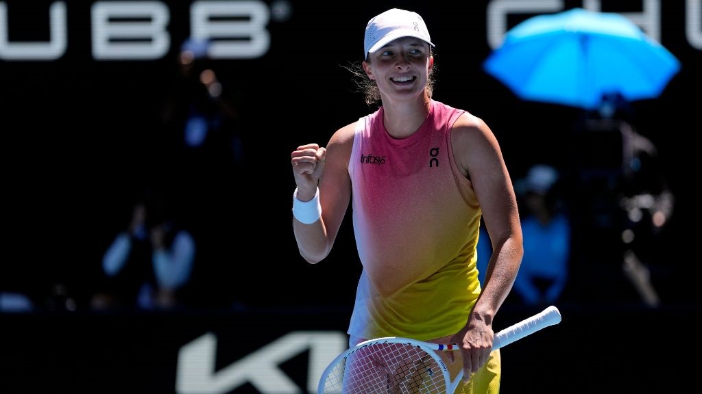 Iga Swiatek of Poland celebrates after defeating Emma Navarro of the U.S. in their quarterfinal match at the Australian Open tennis championship in Melbourne, Australia, Wednesday, Jan. 22, 2025. (AP Photo/Vincent Thian).
