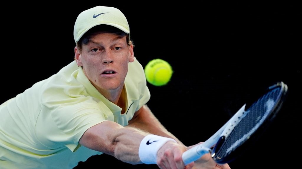 Jannik Sinner of Italy plays a backhand return to Marcos Giron of the U.S. during their third round match at the Australian Open tennis championship in Melbourne, Australia, Saturday, Jan. 18, 2025. (AP Photo/Asanka Brendon Ratnayake).
