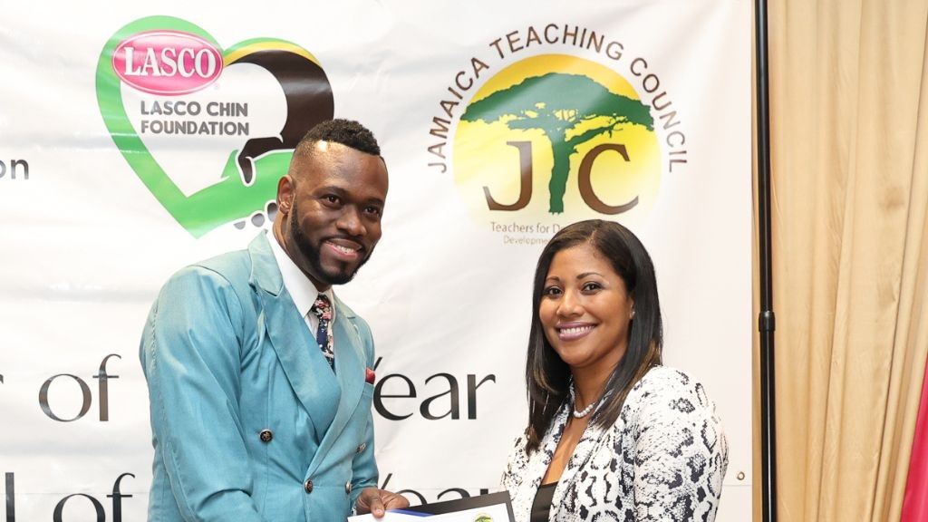 O’neil Stevens, the late Principal of the Jessie Ripoll Primary School in Kingston, was one of 130 educators honoured at the staging of 2024 LASCO, MoEY, JTC Teacher, TVET Teacher & Principal of the Year Awards held on December 6, 2024 at the Jamaica Pegasus Hotel in Kingston, Jamaica. Lisa Watts, Deputy General Manager, LASCO Manufacturing Limited is seen here presenting the principal with his award.
