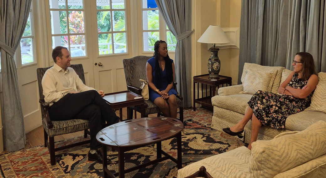 Rhodes Scholar Aundrene Cameron (centre) in discussion with British High Commissioner to Jamaica, Judith Slater (right' Listening is Deputy Commissioner, Jonathan Cook.