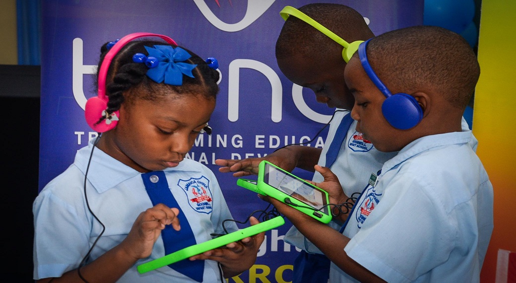 Students of Jamaica China Goodwill Infant School I engage in numeracy and literacy activities on OneTab tablets donated by the Project for the Advancement of Childhood Education (PACE) Canada, in collaboration with local partners, during a handover ceremony held at the Kingston institution on Tuesday (January 7).