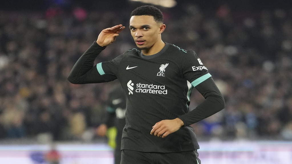 Liverpool's Trent Alexander-Arnold celebrates after scoring his side's fourth goal during the English Premier League football match against West Ham United at the London Stadium in London, Sunday, Dec. 29, 2024. (AP Photo/Kirsty Wigglesworth).