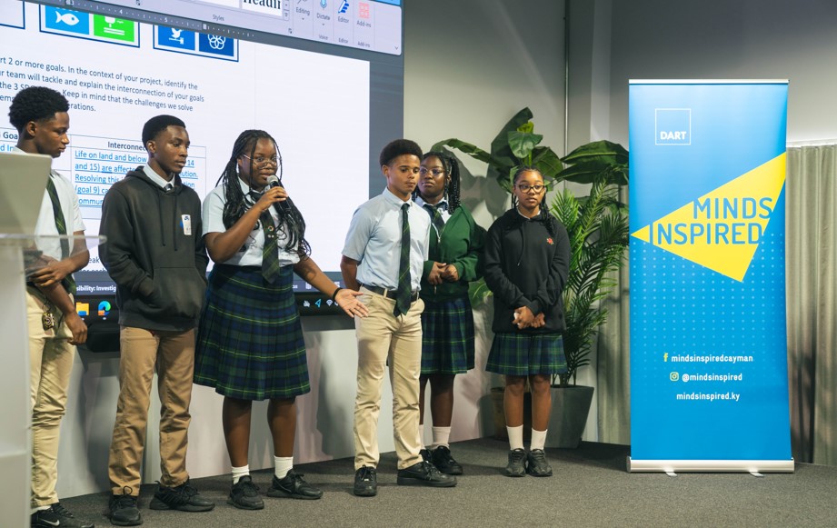 Cayman Academy students present their pitch on using recycled plastic to build roads. 