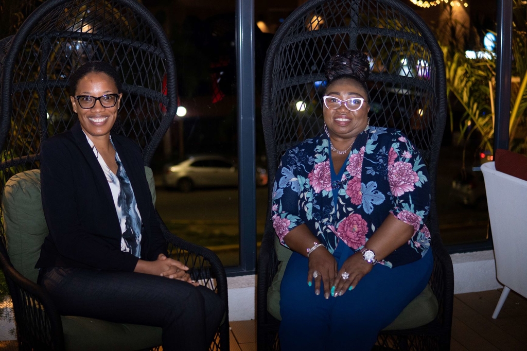 Sitting away from their duties are Alana Lawerence (left), Manager of the JMMB Group Capital Markets Unit, and Barbara Mitchell, Branch Operations Manager of the JMMB – Personal Portfolio Management branch.
