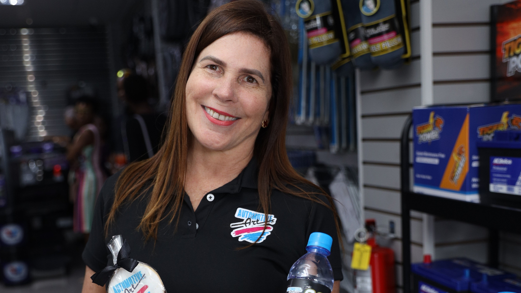 Branded goodies in hand, Stewart’s Automotive Group’s Managing Director, Jacqueline Stewart Lechler, is all smiles during the 20th anniversary celebrations for Automotive Art - a subsidiary of Stewart's Automotive Group.