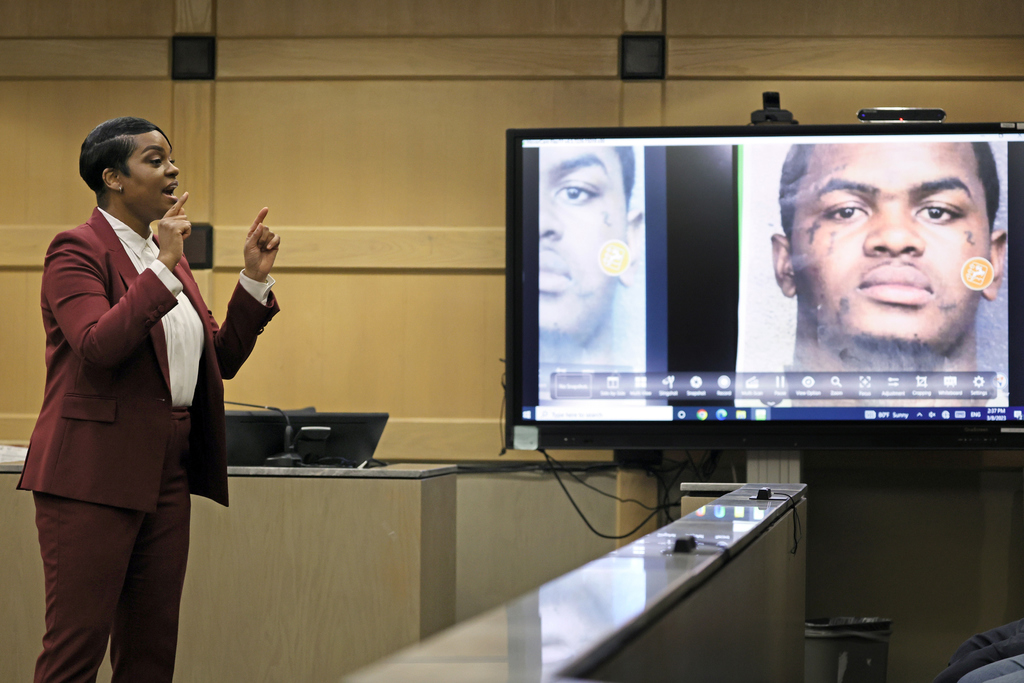 Assistant State Attorney Pascale Achille gives her closing rebuttal with a photograph of suspected shooting accomplice Dedrick Williams displayed on a courtroom monitor in the XXXTentacion murder trial at the Broward County Courthouse in Fort Lauderdale, Fla., Wednesday, March 8, 2023. Emerging rapper XXXTentacion, born Jahseh Onfroy, 20, was killed during a robbery outside of Riva Motorsports in Pompano Beach in 2018, allegedly by defendants Michael Boatwright, Trayvon Newsome, and Williams. (Amy Beth Benn