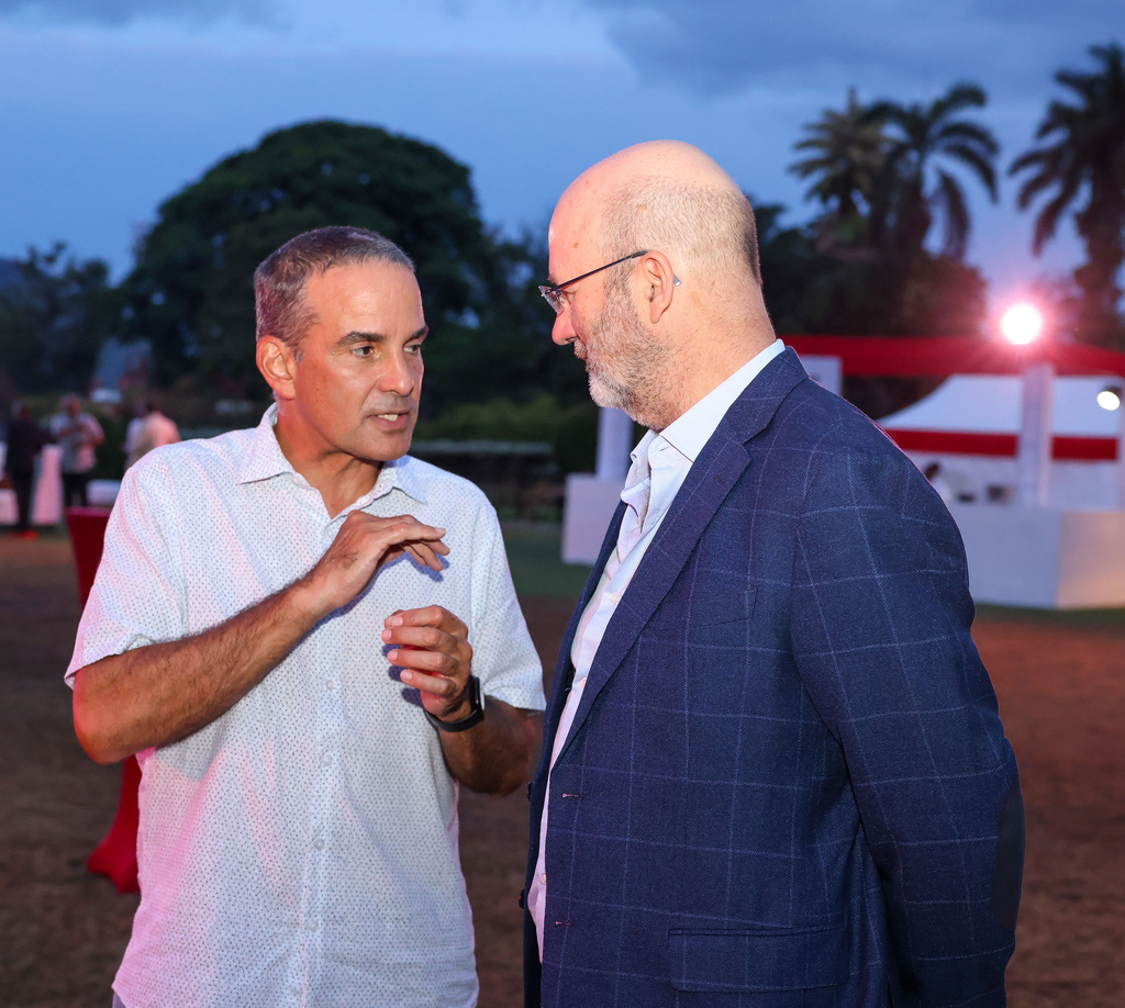 President of the Insurance Company of the West Indies (ICWI), Paul Lalor (left), has a chat with Managing Director at Stewarts Automotive Group, Duncan Stewart during an extraordinary launch of the GWM Haval by Stewarts Automotive Group on May 13 at the Hope Botanical Gardens in Kingston.