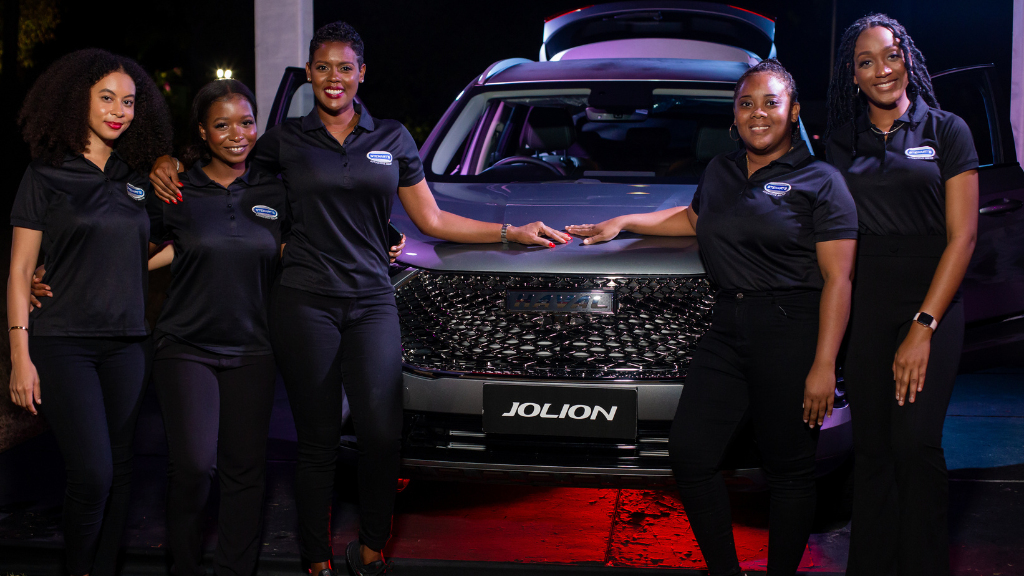 Stewart’s Automotive Group’s marketing team, (from left) Nyoka Whyne, Jodian Campbell, Michaela Francis, Tiffany Simmonds and Christine Charles grab a picture with the GWM Haval Jolion during the GWM Haval Launch at Hope Botanical Gardens on May 13. Stewarts Automotive Group is the authorized dealer for GWM in Jamaica and unveiled the newest premium luxury SUV, the GWM Haval H6 GT Coupe alongside the GWM P-Series pickup truck, GWM Haval Jolion and Haval H6 sports utility vehicles. 
