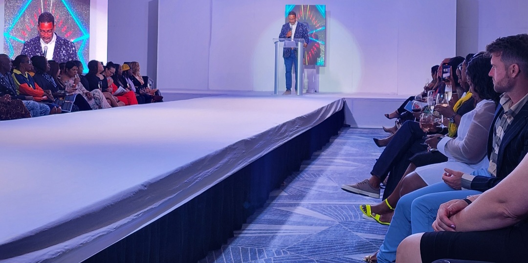 Minister for Tourism, Kenneth Bryan, speaking at Cayman InStyle Fashion Week (Photo credit: Loop News)