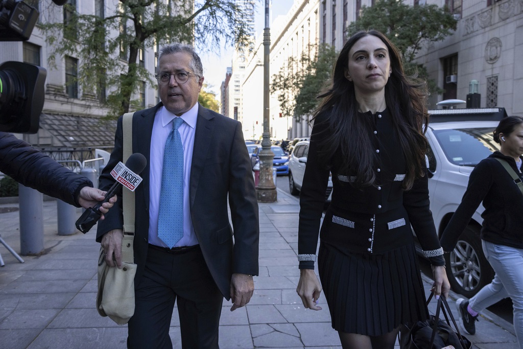 Attorney Marc Agnifilo, left, and Teny Geragos, right, for Sean 