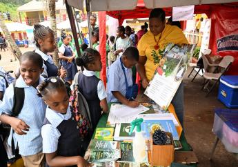 Forest Technician at the Forestry Department, Kerry Ann McLean, interacts with students at the St Ann 4-H Clubs Parish Achievement Day and Expo 2024, held at Brown’s Town Primary School in the parish on Wednesday, April 17. (Photo: JIS)