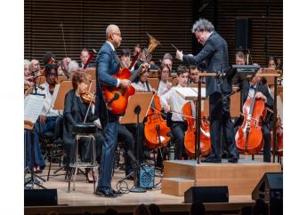 This image released by the New York Philharmonic shows former New York Yankees baseball player Bernie Williams, standing left, with conductor Gustavo Dudamel as he makes his New York Philharmonic debut in New York on Wednesday, April 24, 2024. (Brandon Patoc/New York Philharmonic via AP)



