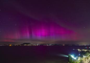 The Northern Lights, or Aurora Borealis, illuminate the night sky over the Lake Balaton, near Fonyod, Hungary, late Friday, May 10, 2024. (Gyorgy Varga//MTI via AP)