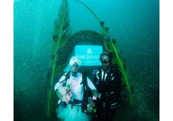 Arthur and Kim Miller have made history as the first Black couple to exchange vows underwater. Photo:Pure Grenada