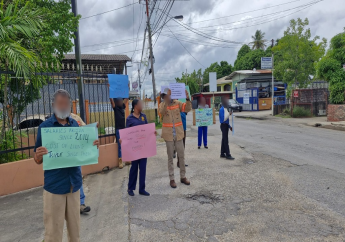 T&TEC workers engaged in peaceful picketing during their lunch hour in California. Photo: OWTU/Facebook