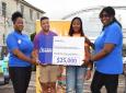 Left to right: Public relations officer of the Mandeville Police Youth Club Ann-Alice Channer, treasurer Dalton Banton and club president Karalia Carr collect a donation of $25,000 from Access Financial Services Mandeville branch manager Karen Bradford. The money goes to the Psychiatric Ward of the Mandeville Regional Hospital, this year’s recipient of the 5K fundraiser. 