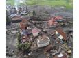 This drone photo shows the damage at a village affected by a flash flood in Agam, West Sumatra, Indonesia, Tuesday, May 14, 2024. (AP Photo/Sutan Malik Kayo)